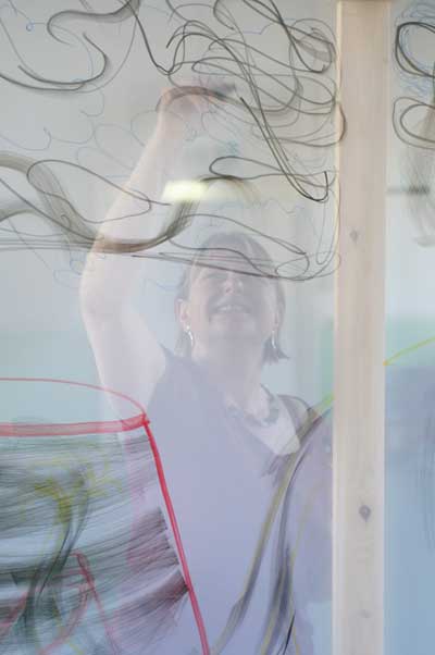 Sally rehearsing for Obscurity performances with transparent screens