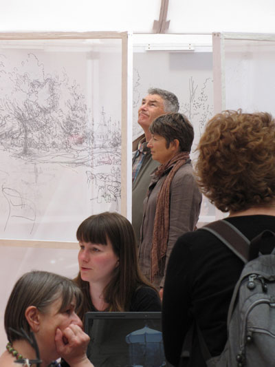 Visitors looking at finished drawing tent.