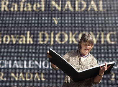 Sally drawing by the scoreboard Centre Court