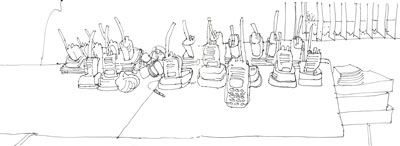Groundstaff walkie talkies and remote controls pen on paper