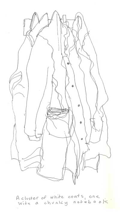 A-cluster-of-white-coats---one-with-a-chunky-notebook