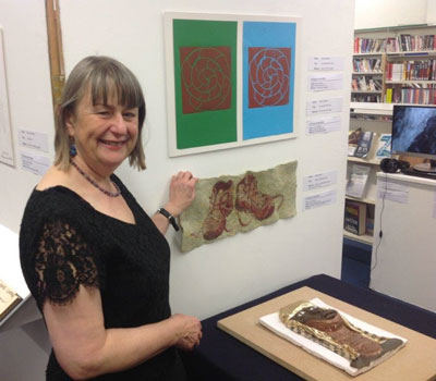 Sally in front of her drawing